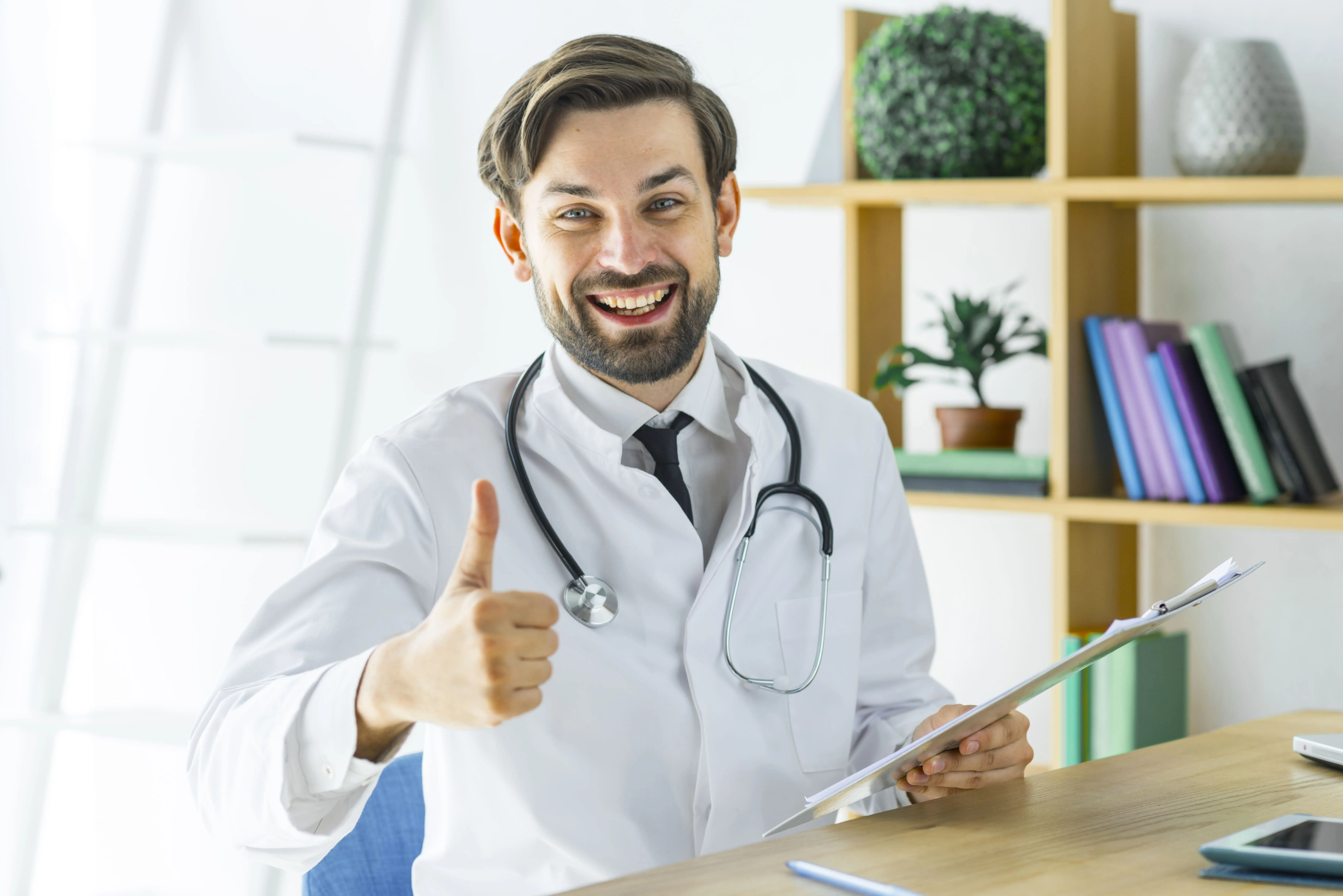 Doctor giving a thumbs up during a medical consultation