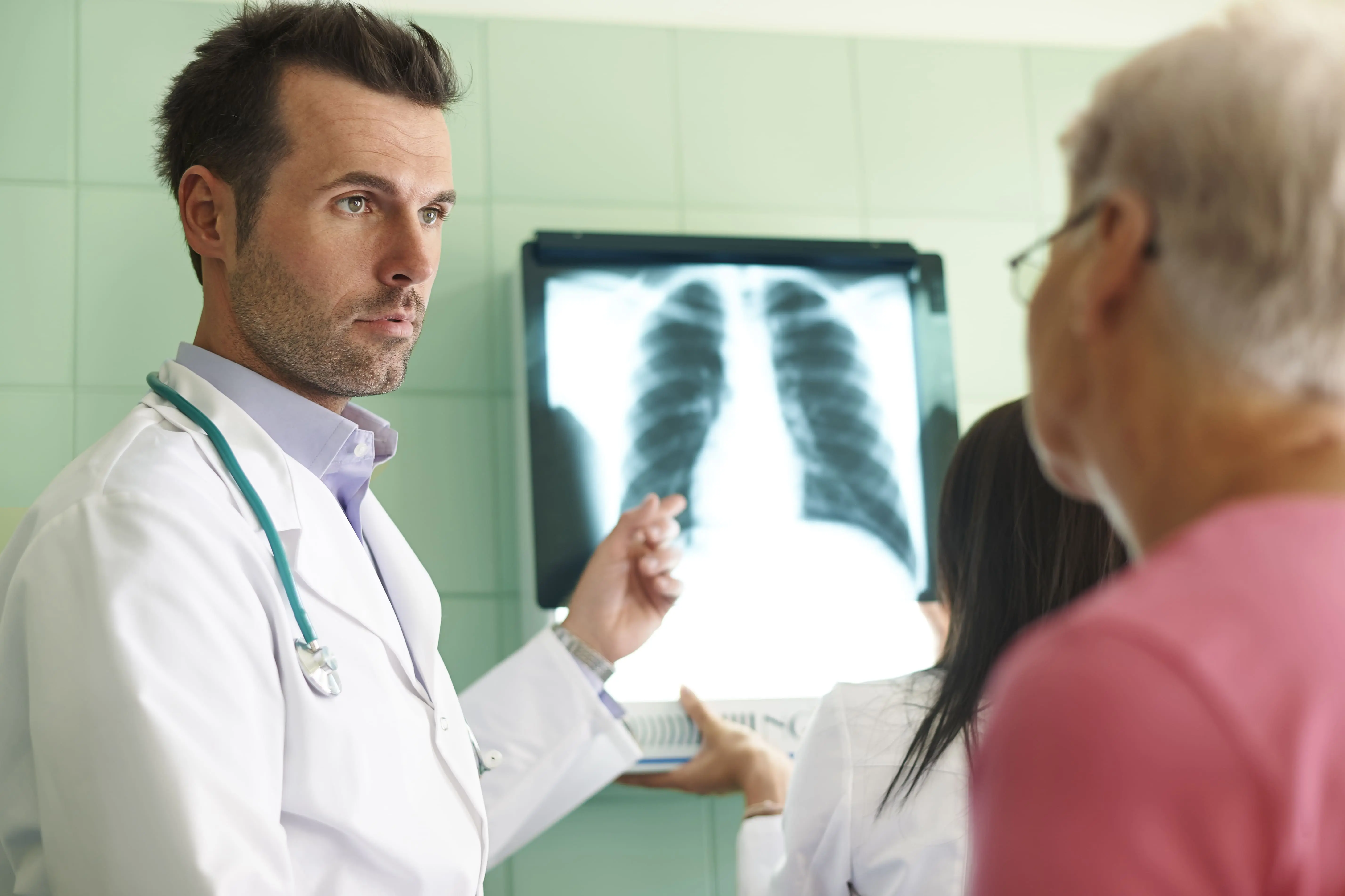 Doctor reviewing a lung X-ray and explaining respiratory diagnosis to a patient, supported through international medical treatment coordination by 360Five Medicare
